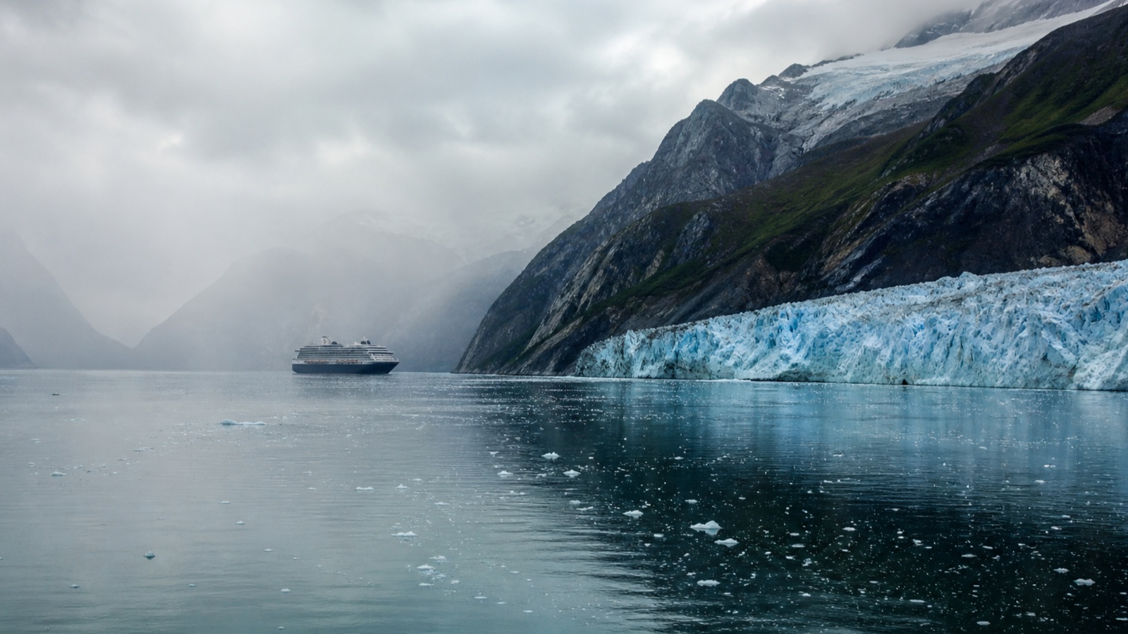 A cruise ship in a misty Alaska glacier passage